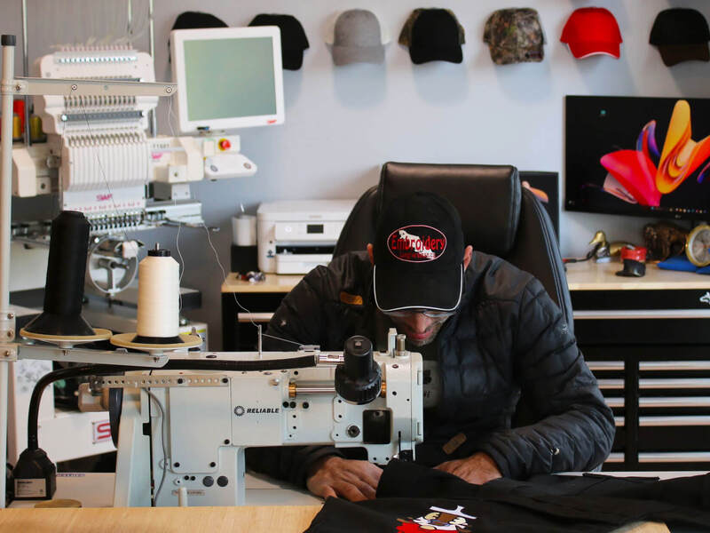 man working at a fewing machine